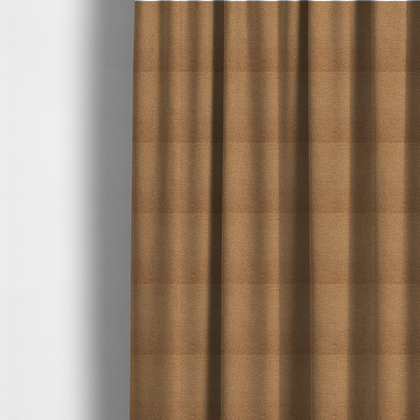The fabric used to create these made-to-measure curtains is a textured camel brown bouclé upholstery fabric.