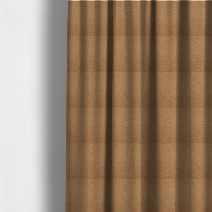 The fabric used to create these made-to-measure curtains is a textured camel brown bouclé upholstery fabric.