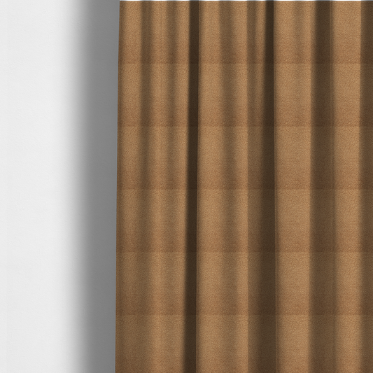 The fabric used to create these made-to-measure curtains is a textured camel brown bouclé upholstery fabric.