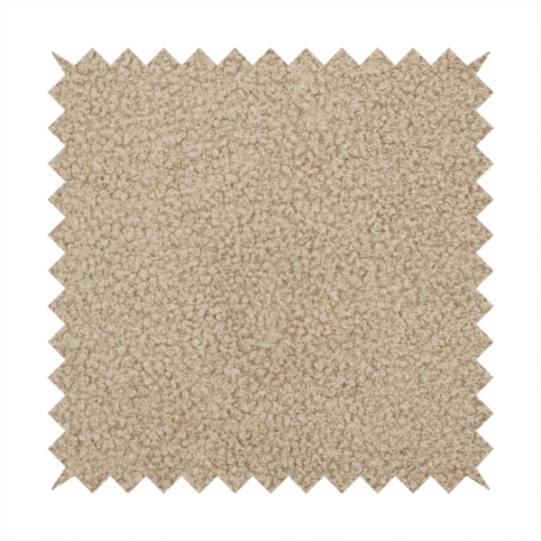 A textured khaki or warm taupe bouclé upholstery fabric.
