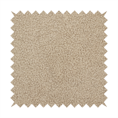 A textured khaki or warm taupe bouclé upholstery fabric.