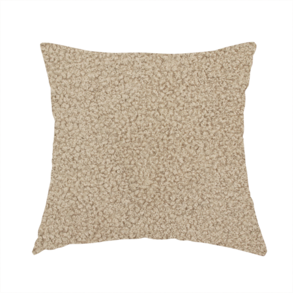 The fabric used to create this handmade cushion is a textured khaki or warm taupe bouclé upholstery fabric.