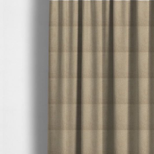 The fabric used to create these made-to-measure curtains is a textured khaki or warm taupe bouclé upholstery fabric.
