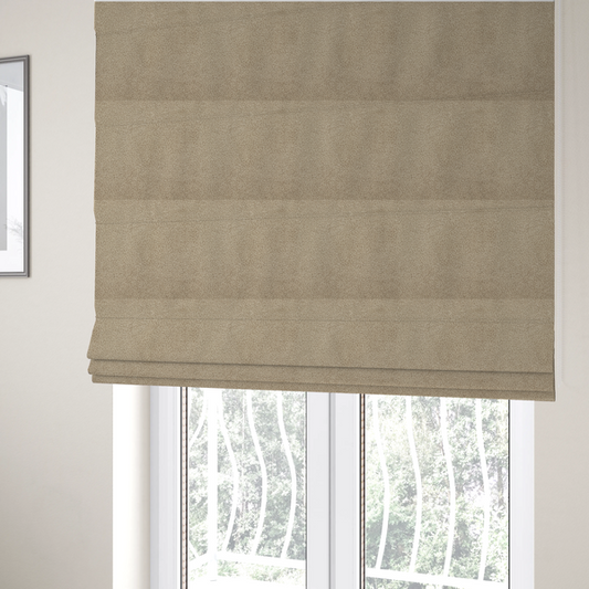 The fabric used to create these Roman blinds is a textured khaki or warm taupe bouclé upholstery fabric.