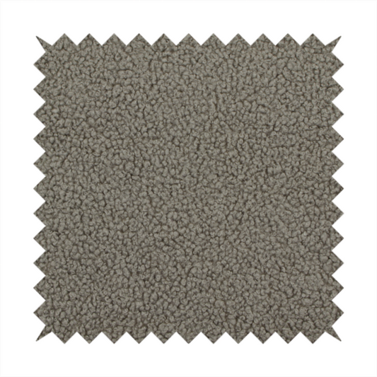 A textured greyish-brown or elephant grey bouclé upholstery fabric.