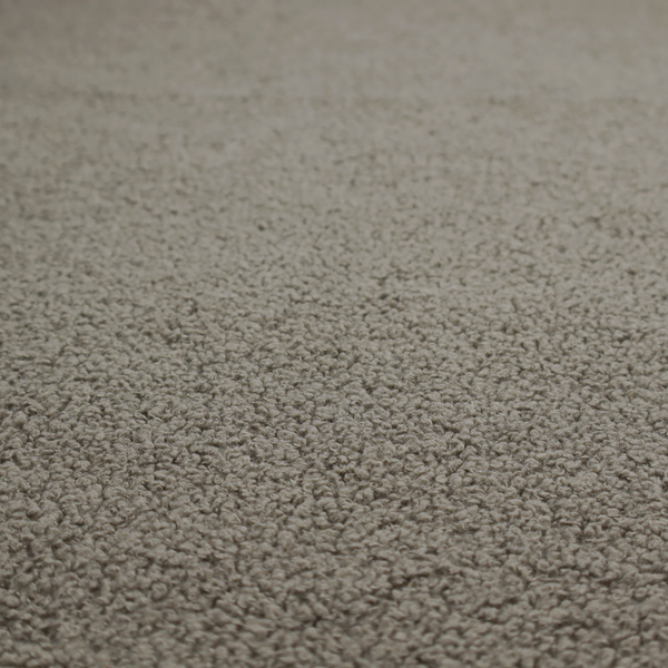 A textured greyish-brown or elephant grey bouclé upholstery fabric.