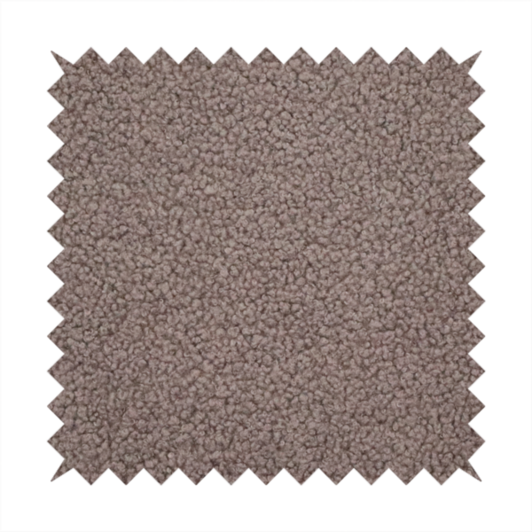 A textured rosy-brown or mauve bouclé upholstery fabric.