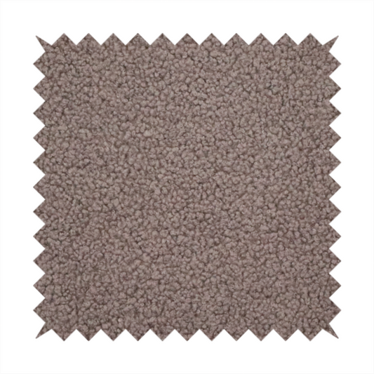 A textured rosy-brown or mauve bouclé upholstery fabric.