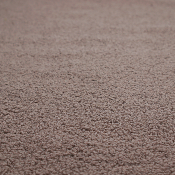A textured rosy-brown or mauve bouclé upholstery fabric.