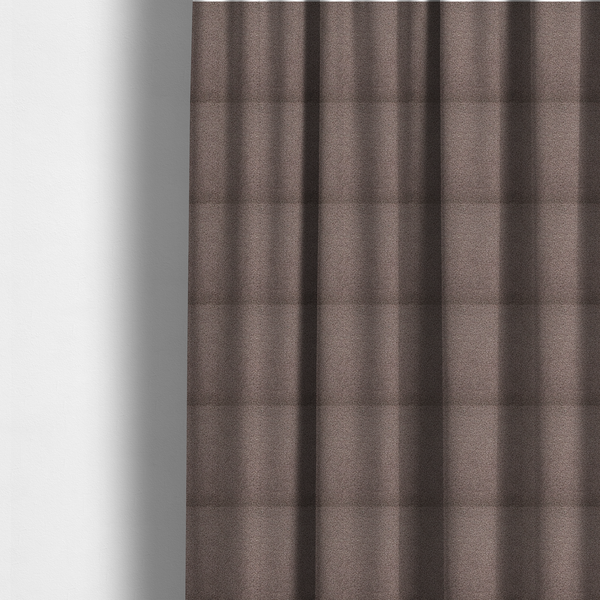 The fabric used to create these made-to-measure curtains is a textured rosy-brown or mauve bouclé upholstery fabric.