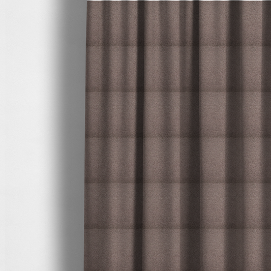 The fabric used to create these made-to-measure curtains is a textured rosy-brown or mauve bouclé upholstery fabric.