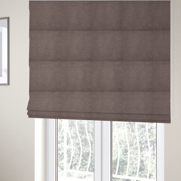 The fabric used to create these Roman blinds is a textured rosy-brown or mauve bouclé upholstery fabric.