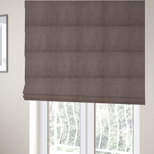 The fabric used to create these Roman blinds is a textured rosy-brown or mauve bouclé upholstery fabric.