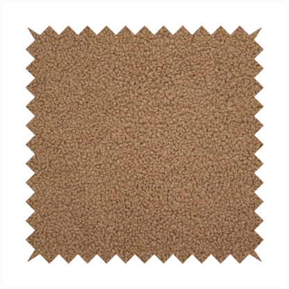 A textured medium brown or chestnut bouclé upholstery fabric.