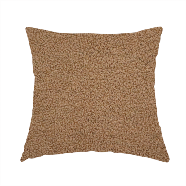 The fabric used to create this handmade cushion is a textured medium brown or chestnut bouclé upholstery fabric.