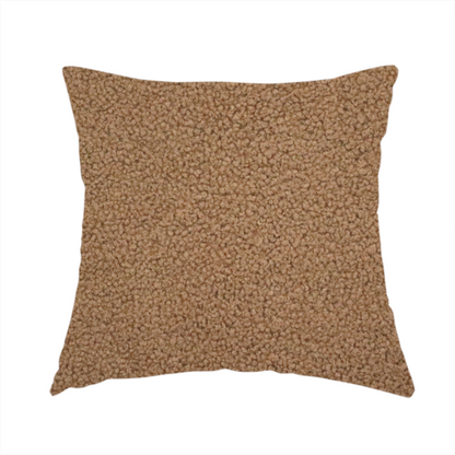 The fabric used to create this handmade cushion is a textured medium brown or chestnut bouclé upholstery fabric.