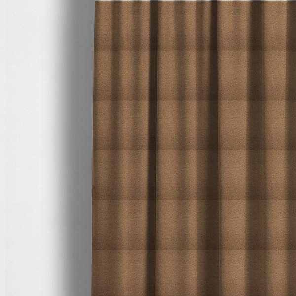 The fabric used to create these made-to-measure curtains is a textured medium brown or chestnut bouclé upholstery fabric.