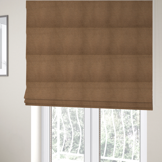 The fabric used to create these Roman blinds is a textured medium brown or chestnut bouclé upholstery fabric.