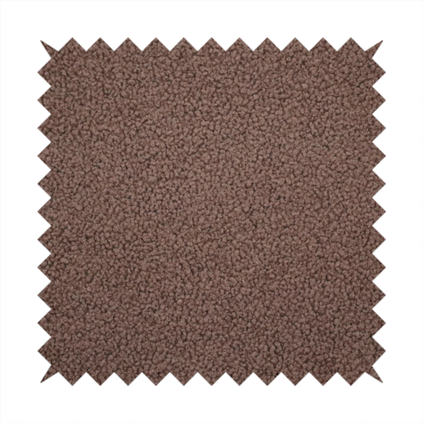 A textured chocolate brown bouclé upholstery fabric.