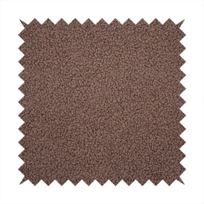 A textured chocolate brown bouclé upholstery fabric.