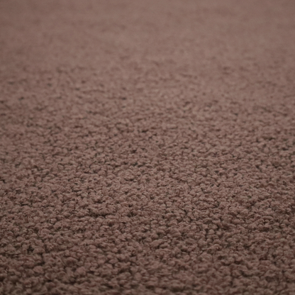 A textured chocolate brown bouclé upholstery fabric.