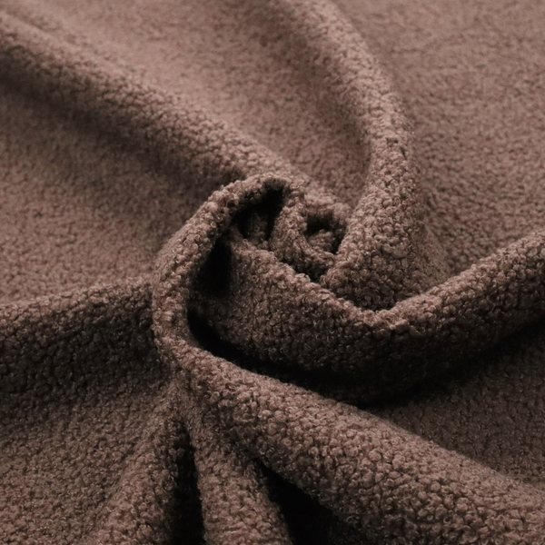 A textured chocolate brown bouclé upholstery fabric.