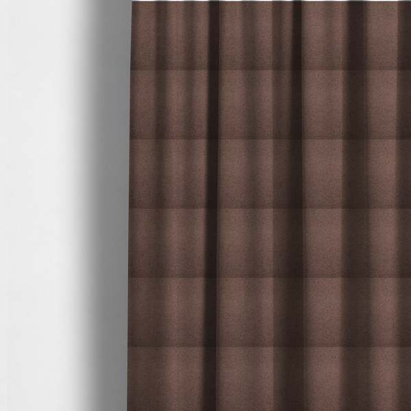 The fabric used to create these made-to-measure curtains is a textured chocolate brown bouclé upholstery fabric.