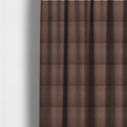 The fabric used to create these made-to-measure curtains is a textured chocolate brown bouclé upholstery fabric.