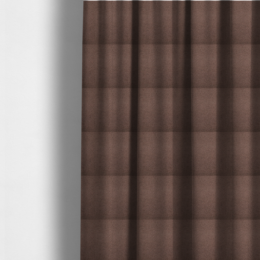 The fabric used to create these made-to-measure curtains is a textured chocolate brown bouclé upholstery fabric.
