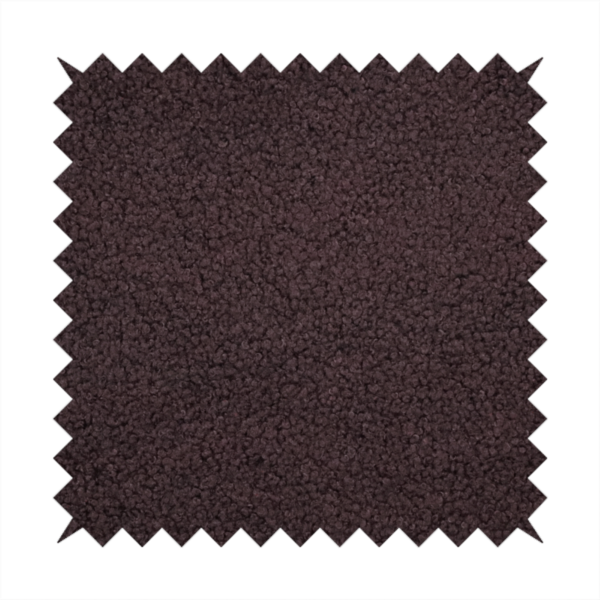 A textured dark espresso brown or deep plum bouclé upholstery fabric.