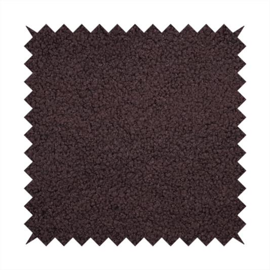 A textured dark espresso brown or deep plum bouclé upholstery fabric.