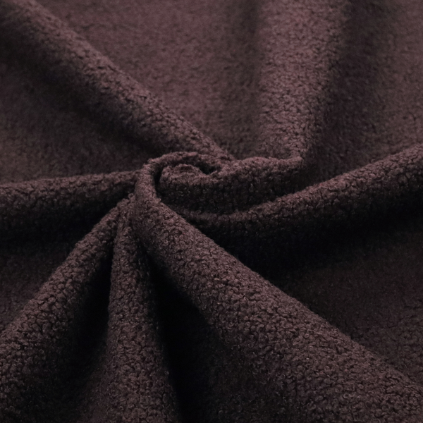 A textured dark espresso brown or deep plum bouclé upholstery fabric.