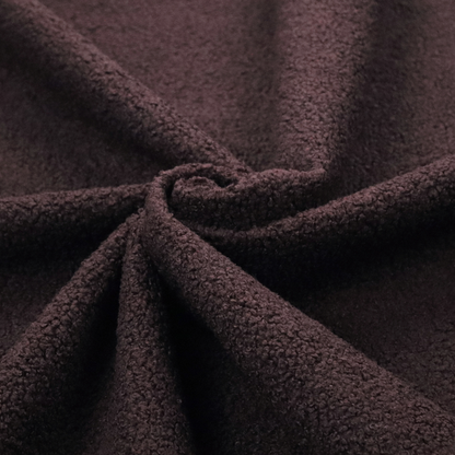 A textured dark espresso brown or deep plum bouclé upholstery fabric.