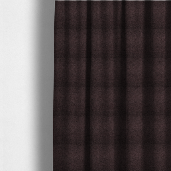 The fabric used to create these made-to-measure curtains is a textured dark espresso brown or deep plum bouclé upholstery fabric.