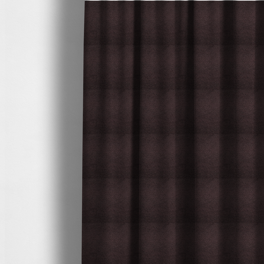 The fabric used to create these made-to-measure curtains is a textured dark espresso brown or deep plum bouclé upholstery fabric.