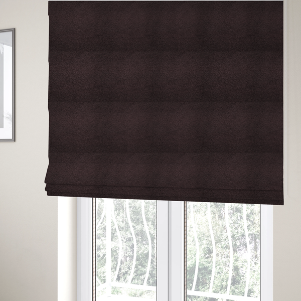 The fabric used to create these Roman blinds is a textured dark espresso brown or deep plum bouclé upholstery fabric.