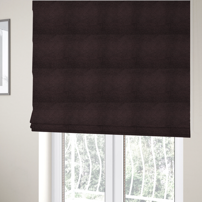 The fabric used to create these Roman blinds is a textured dark espresso brown or deep plum bouclé upholstery fabric.