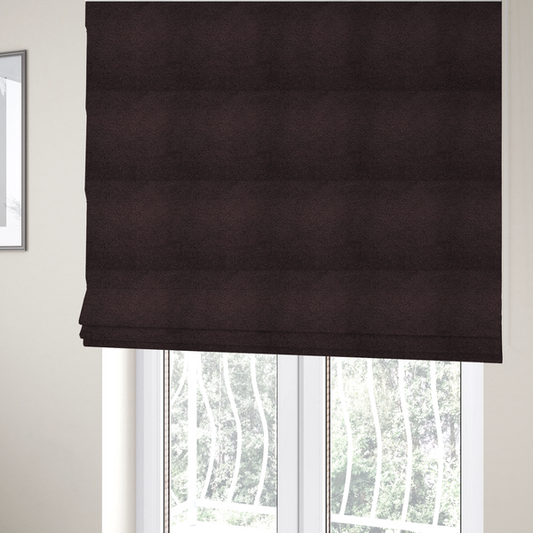 The fabric used to create these Roman blinds is a textured dark espresso brown or deep plum bouclé upholstery fabric.