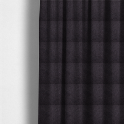 The fabric used to create these made-to-measure curtains is a textured dark plum or deep charcoal purple bouclé upholstery fabric.