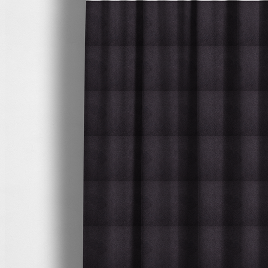 The fabric used to create these made-to-measure curtains is a textured dark plum or deep charcoal purple bouclé upholstery fabric.