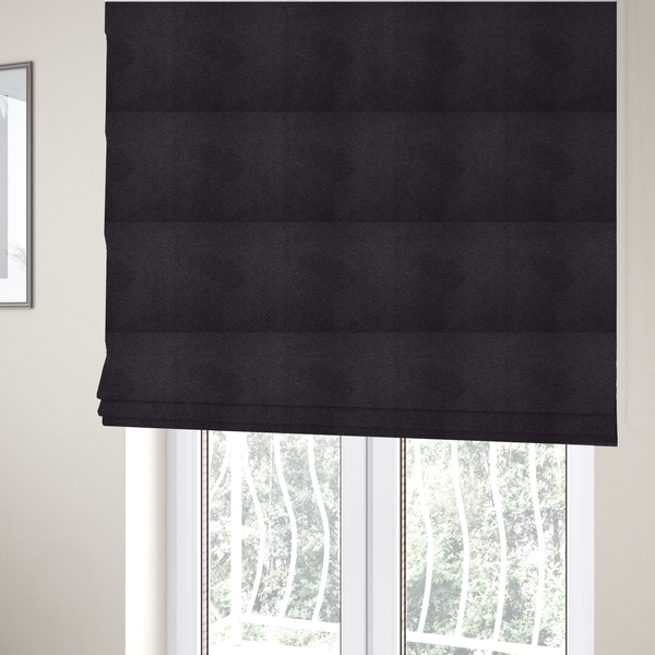 The fabric used to create these Roman blinds is a textured dark plum or deep charcoal purple bouclé upholstery fabric.