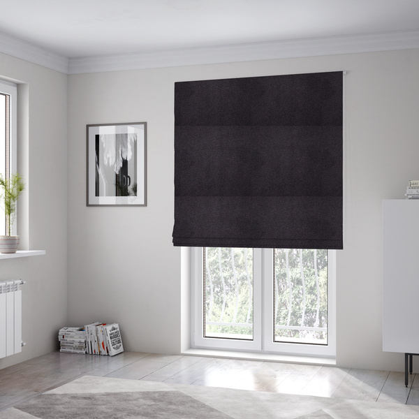 The fabric used to create these Roman blinds is a textured dark plum or deep charcoal purple bouclé upholstery fabric.