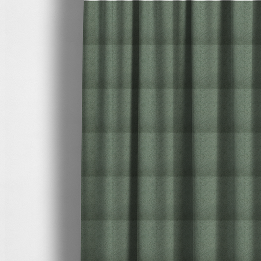 The fabric used to create these made-to-measure curtains is a textured sage green or muted jade bouclé upholstery fabric.