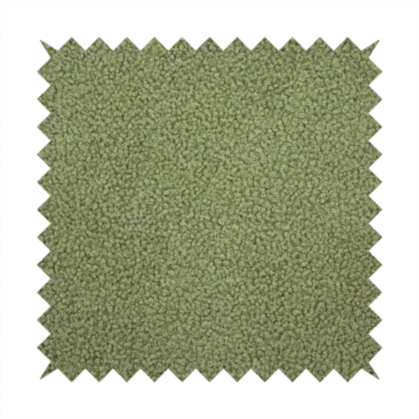 A dense, tightly looped, and pebbled surface characteristic of heavy wool or fleece, with subtle variations in light and shadow highlighting its nappy, tactile pile.
