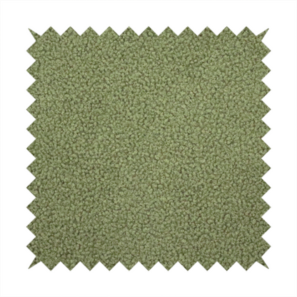 A dense, tightly looped, and pebbled surface characteristic of heavy wool or fleece, with subtle variations in light and shadow highlighting its nappy, tactile pile.