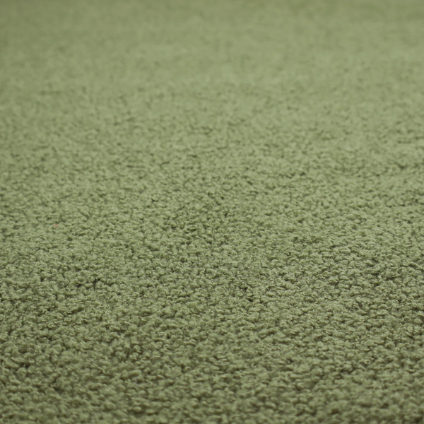 A dense, tightly looped, and pebbled surface characteristic of heavy wool or fleece, with subtle variations in light and shadow highlighting its nappy, tactile pile.