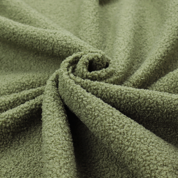 A dense, tightly looped, and pebbled surface characteristic of heavy wool or fleece, with subtle variations in light and shadow highlighting its nappy, tactile pile.
