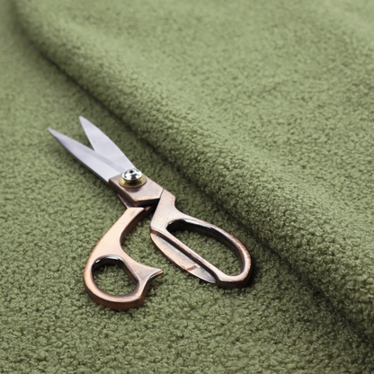 A dense, tightly looped, and pebbled surface characteristic of heavy wool or fleece, with subtle variations in light and shadow highlighting its nappy, tactile pile.