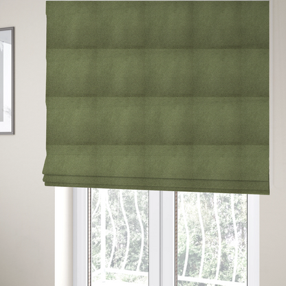 The fabric used to create these Roman blinds is a dense, tightly looped, and pebbled surface characteristic of heavy wool or fleece, with subtle variations in light and shadow highlighting its nappy, tactile pile.