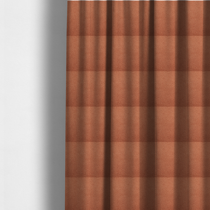 The fabric used to create these made-to-measure curtains is a terracotta or rust-orange boucle fabric texture.